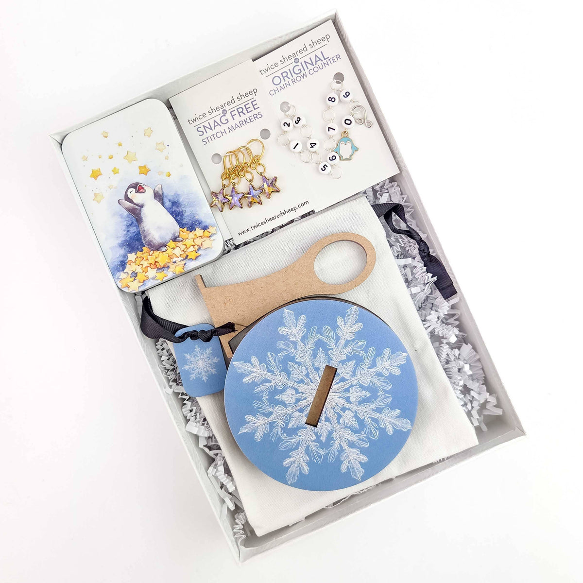 Twice Sheared Sheep gift box with gift featuring snowflake design and assorted cozy items
