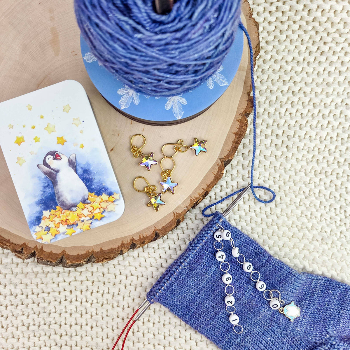 Twice Sheared Sheep gift box with gift featuring yarn, star stitch markers, and a cute card