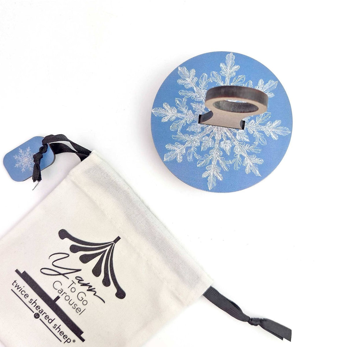 Twice Sheared Sheep gift box with gift featuring a snowflake design and a yarn tool