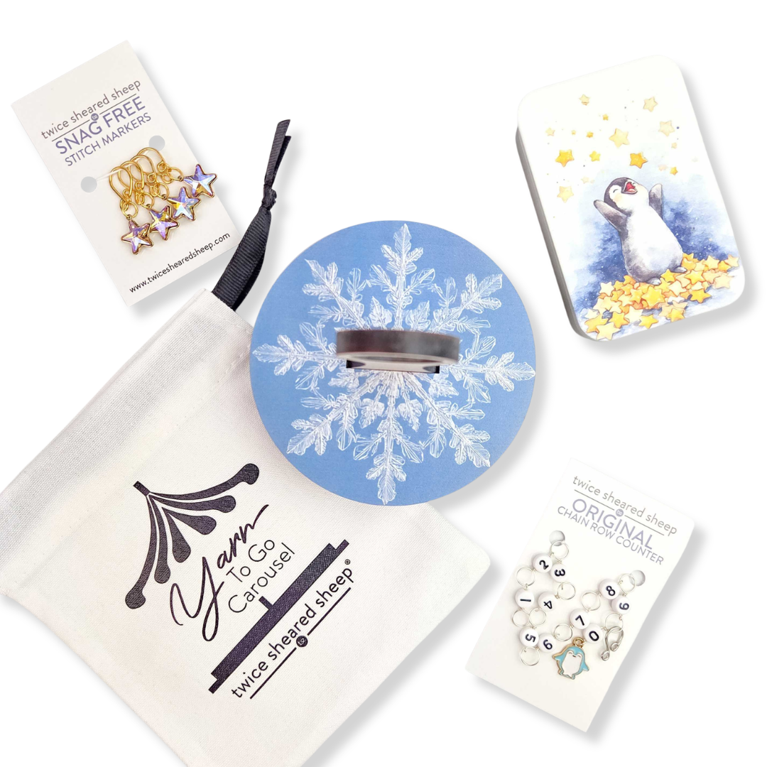 Twice Sheared Sheep gift box with gift featuring winter-themed items and stitch markers