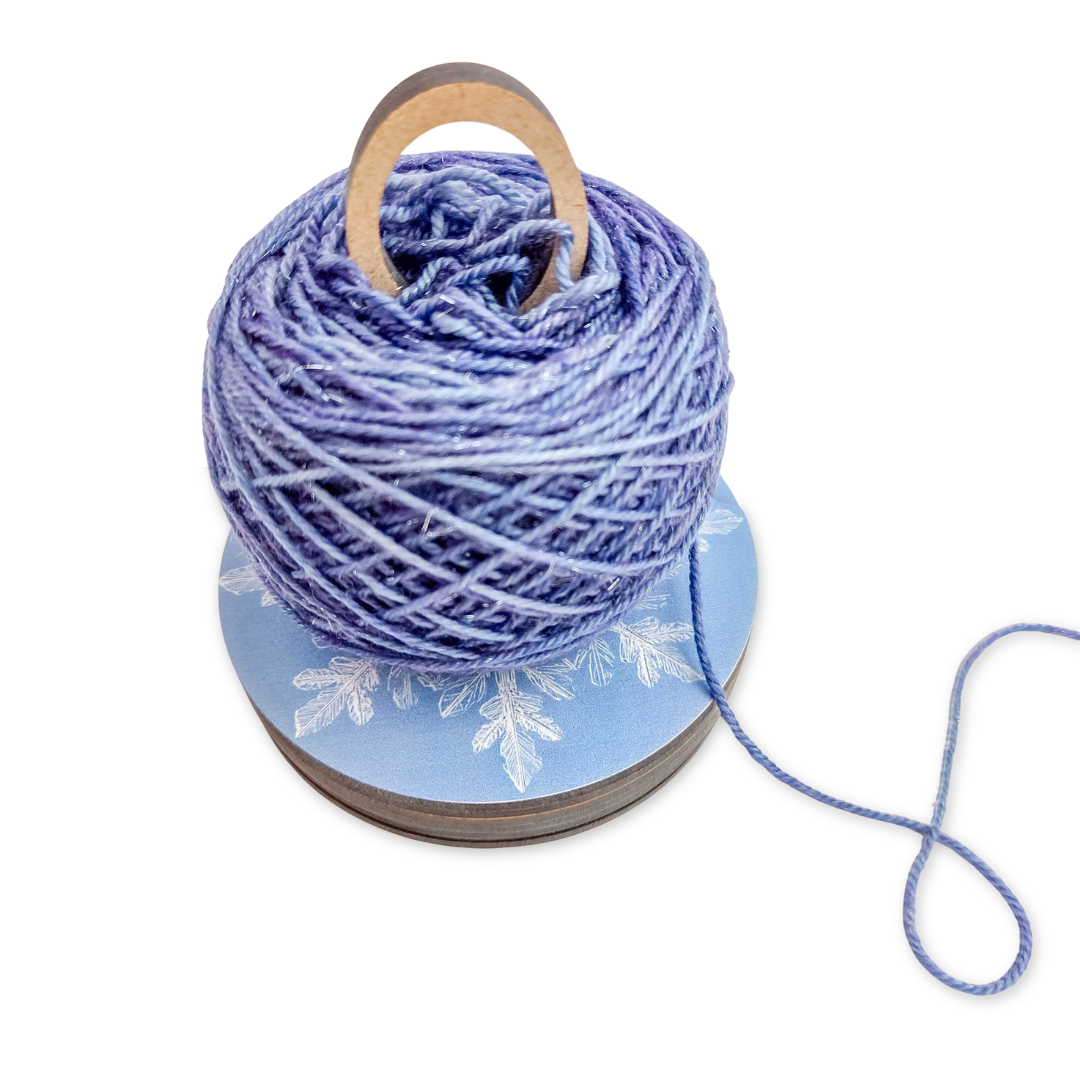 Twice Sheared Sheep lavender yarn on a wooden bobbin, perfect for a gift box with gift.