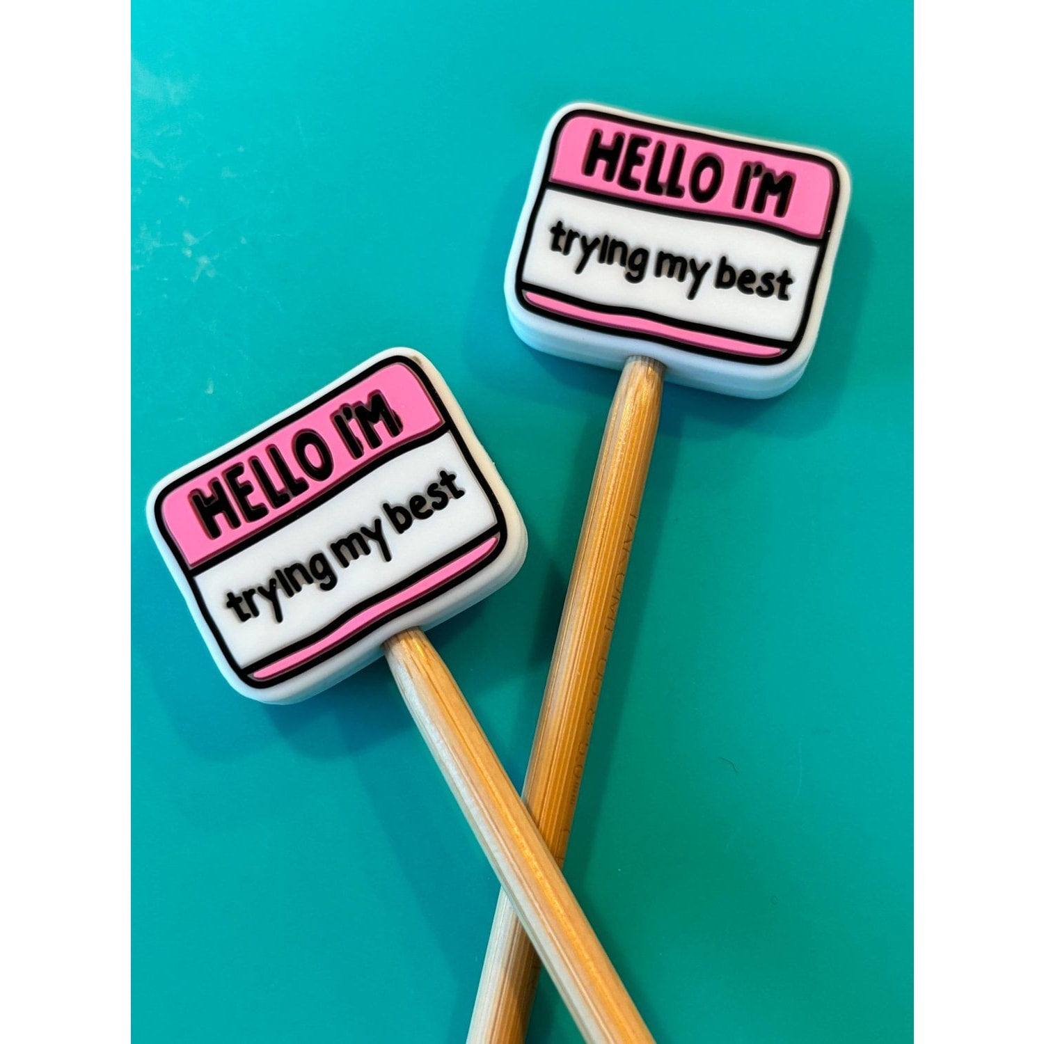 Colorful knitting accessories for knitting featuring motivational erasers with cheerful messages