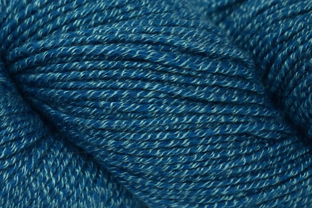 Universal Yarn Wool Pop in deep blue color, showcasing soft and durable texture for knitting and crocheting projects