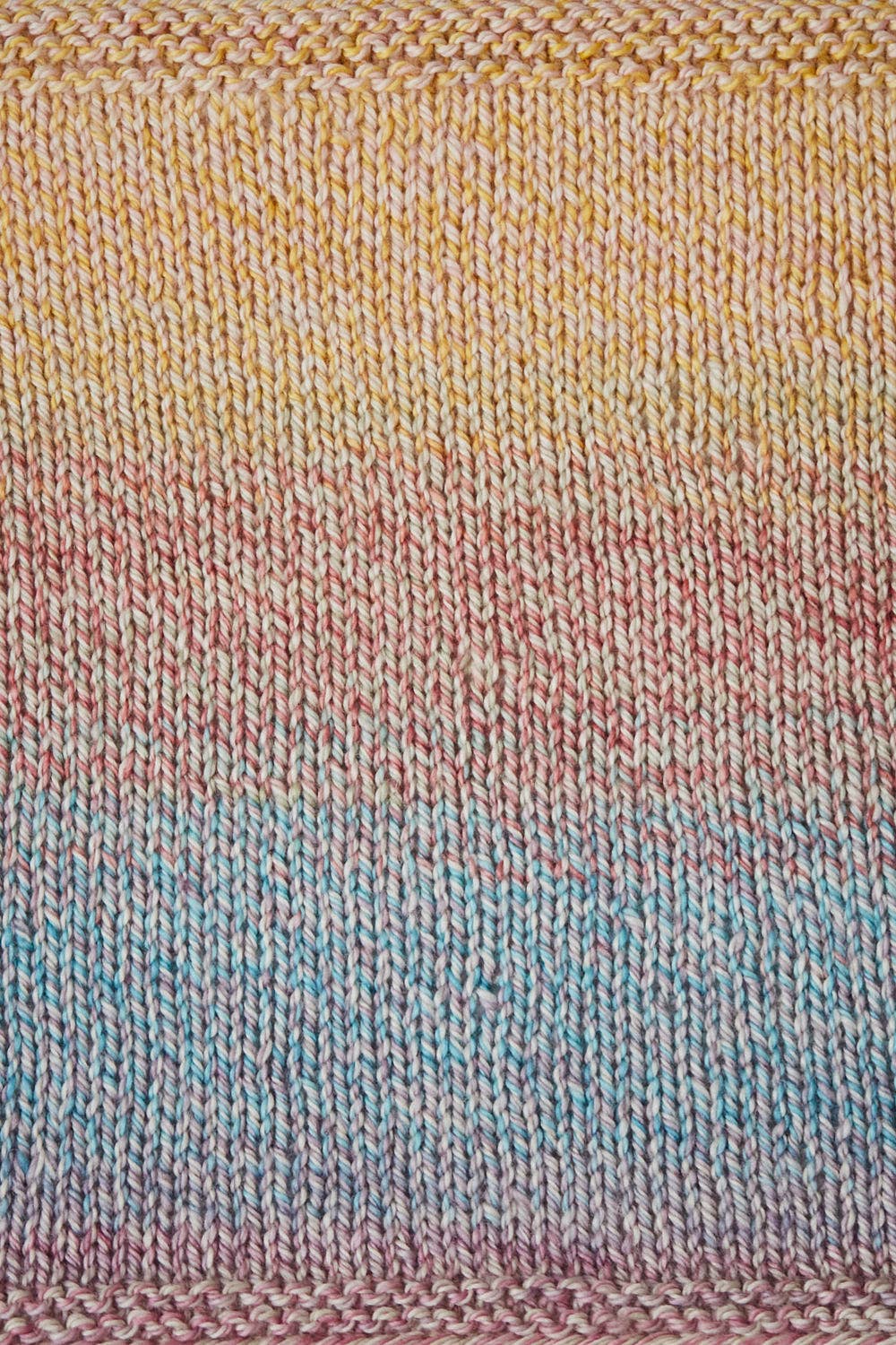 Urth Yarns Spiral Grain Light Worsted in soft gradient colors perfect for creating stunning knitwear