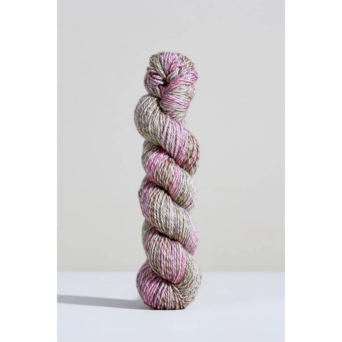 Urth Yarns Spiral Grain Light Worsted in pink and green hues, perfect for knitting and crochet projects
