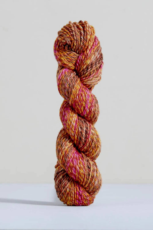 Urth Yarns Spiral Grain Light Worsted Teak with rich orange and pink tones for knitting projects