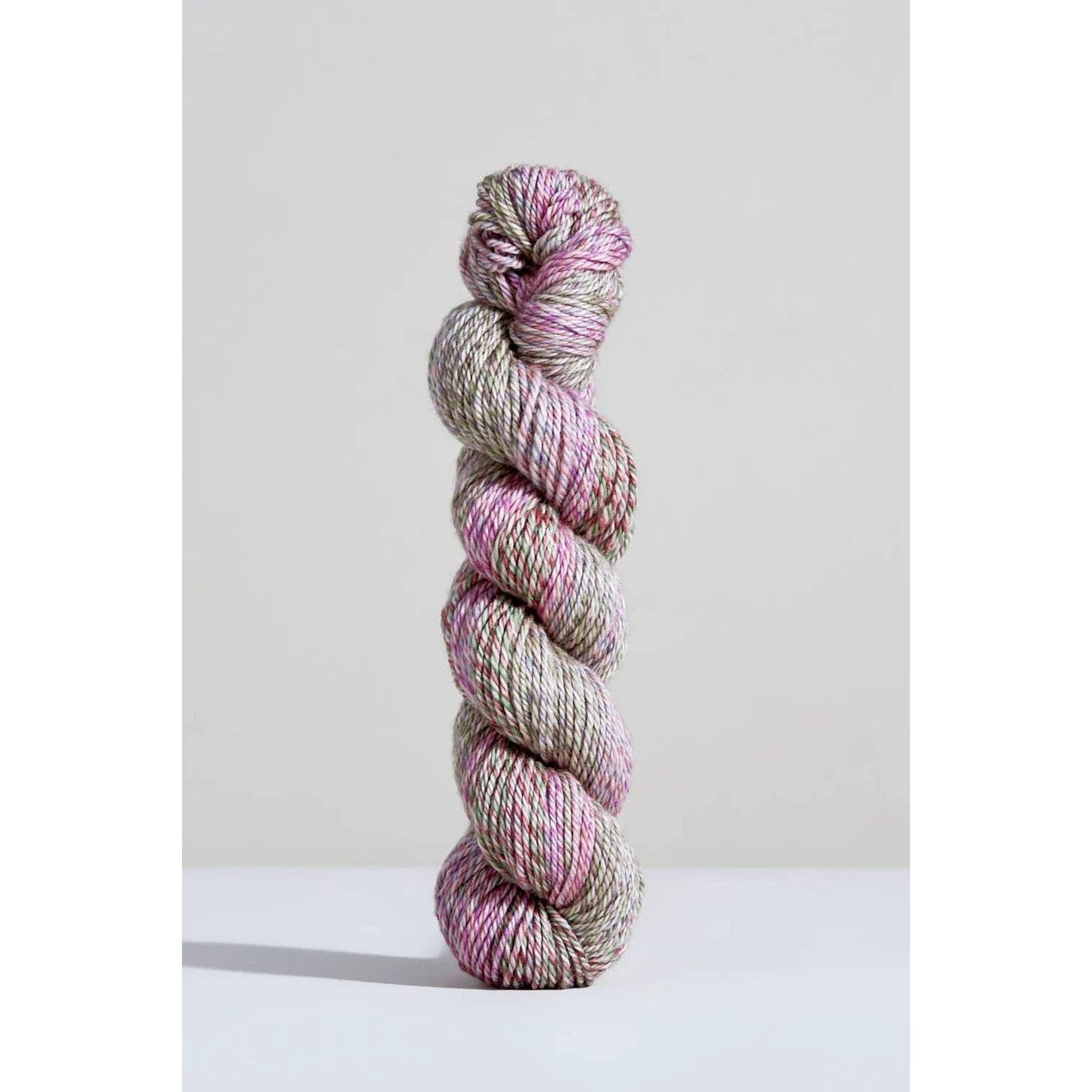 Urth Yarns Spiral Grain Light Worsted in soft pink and green tones for knitting and crafting projects