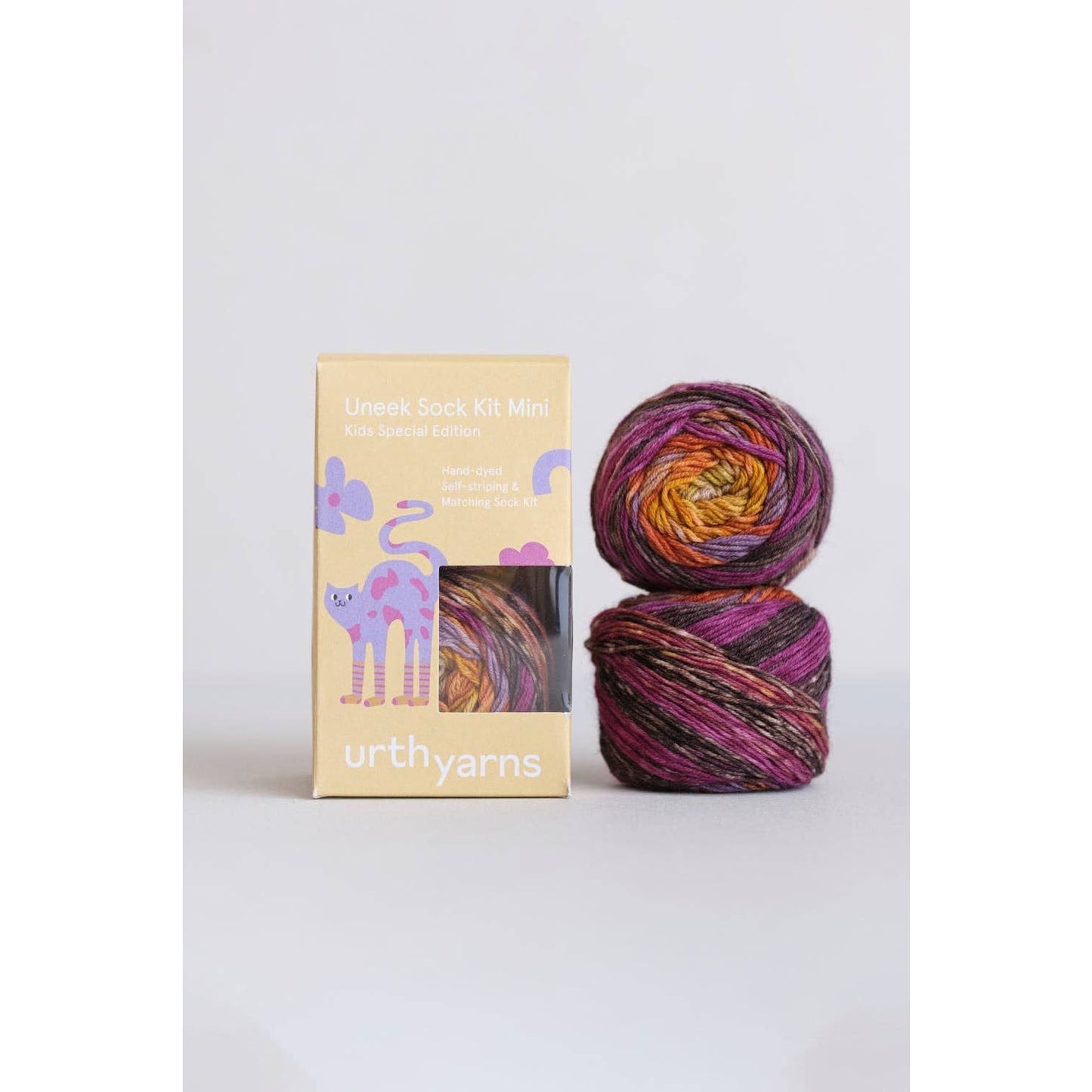 Urth Yarns Uneek Sock Kit Mini in vibrant colors with two skeins and colorful packaging