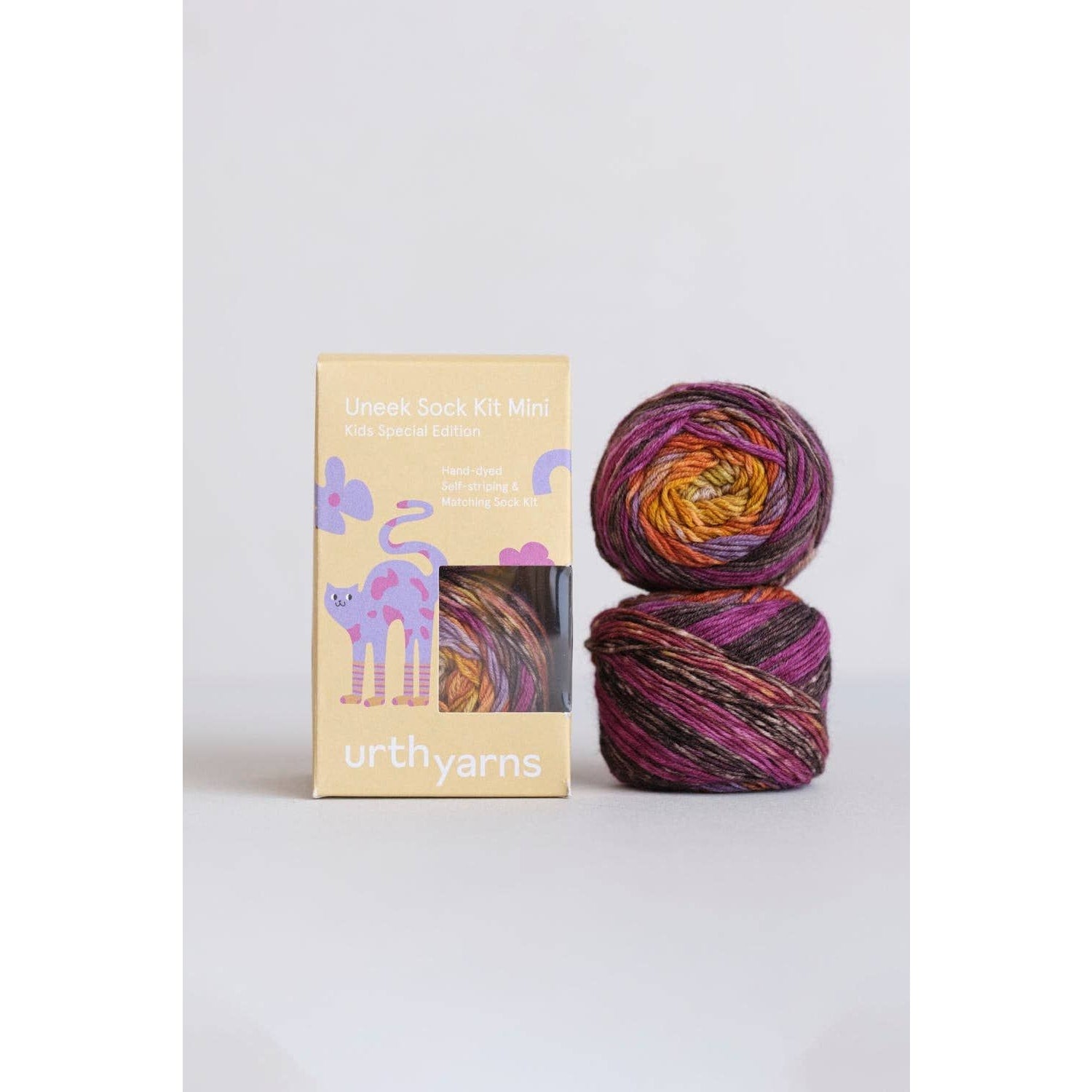 Urth Yarns Uneek Sock Kit Mini in vibrant colors with two skeins and colorful packaging