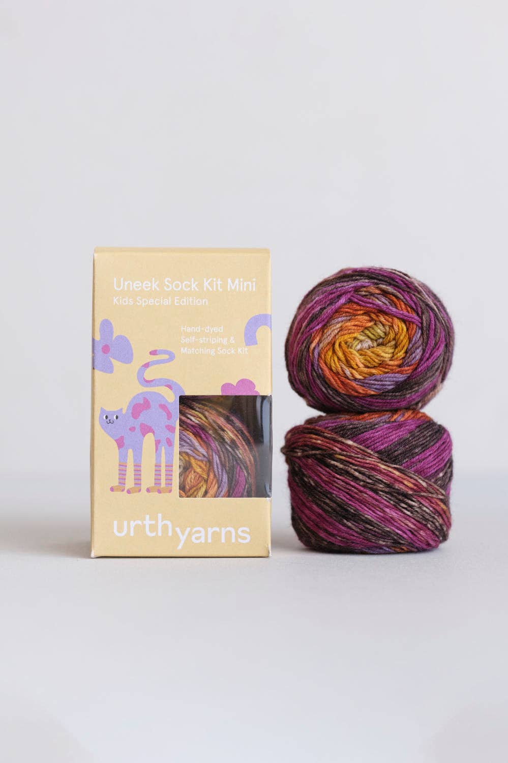 Urth Yarns Uneek Sock Kit Mini in vibrant colors with two skeins and colorful packaging