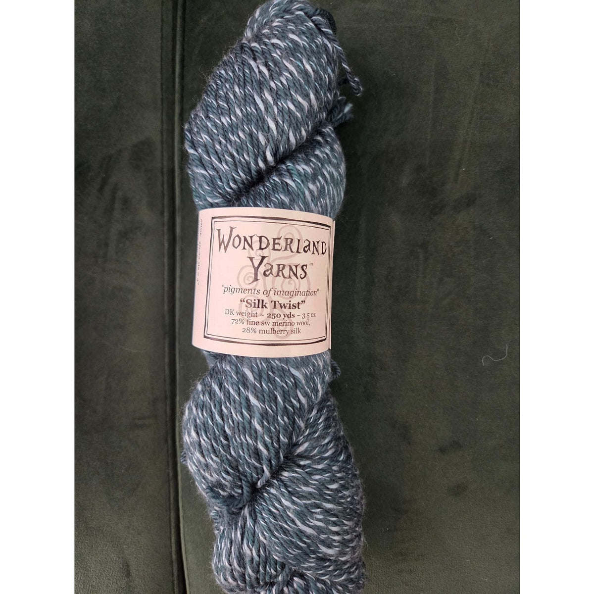 Wonderland Yarns Silk Twist in a soft gray blend, perfect for knitting and crocheting projects