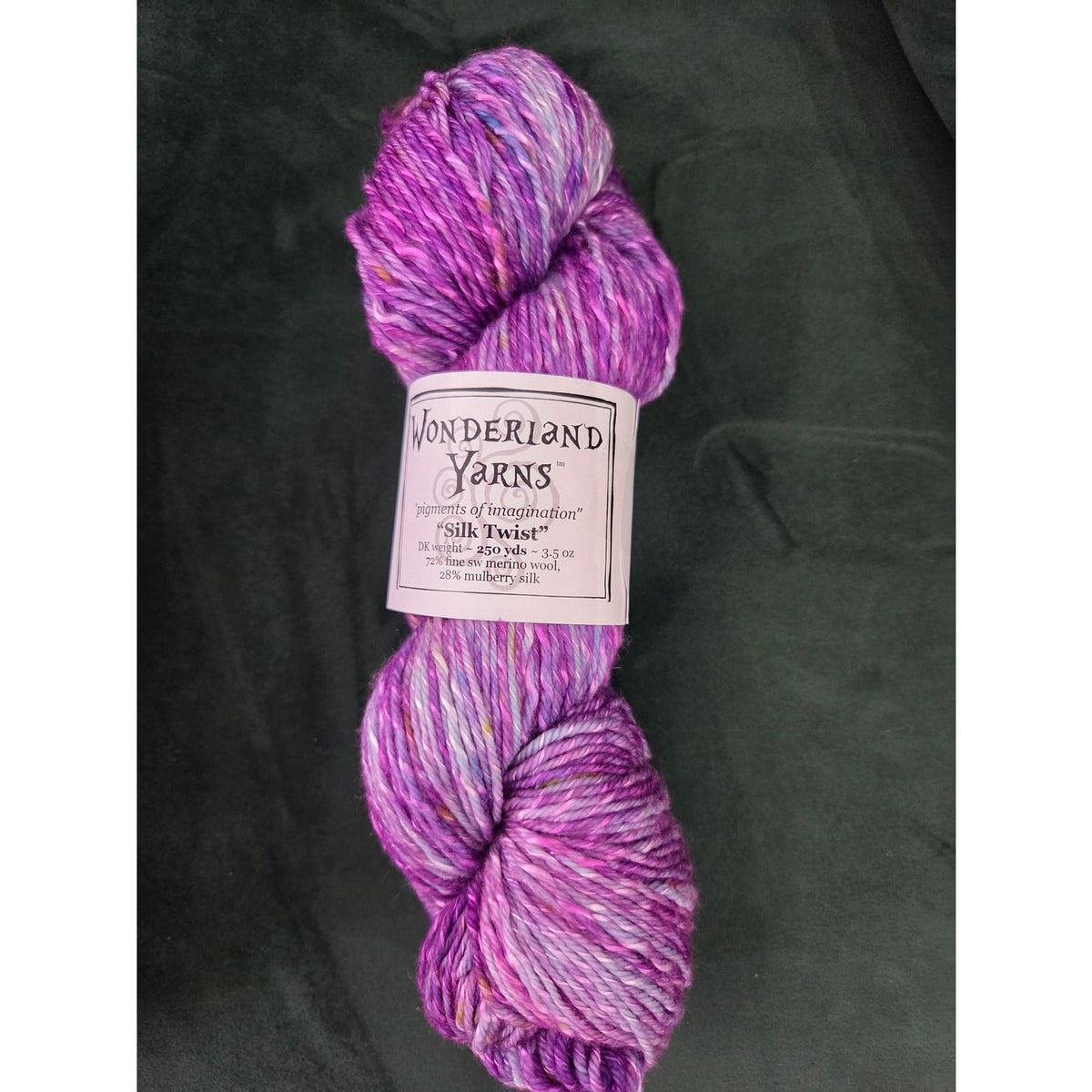 Wonderland Yarns Silk Twist in vibrant purple hues for knitting and crochet projects