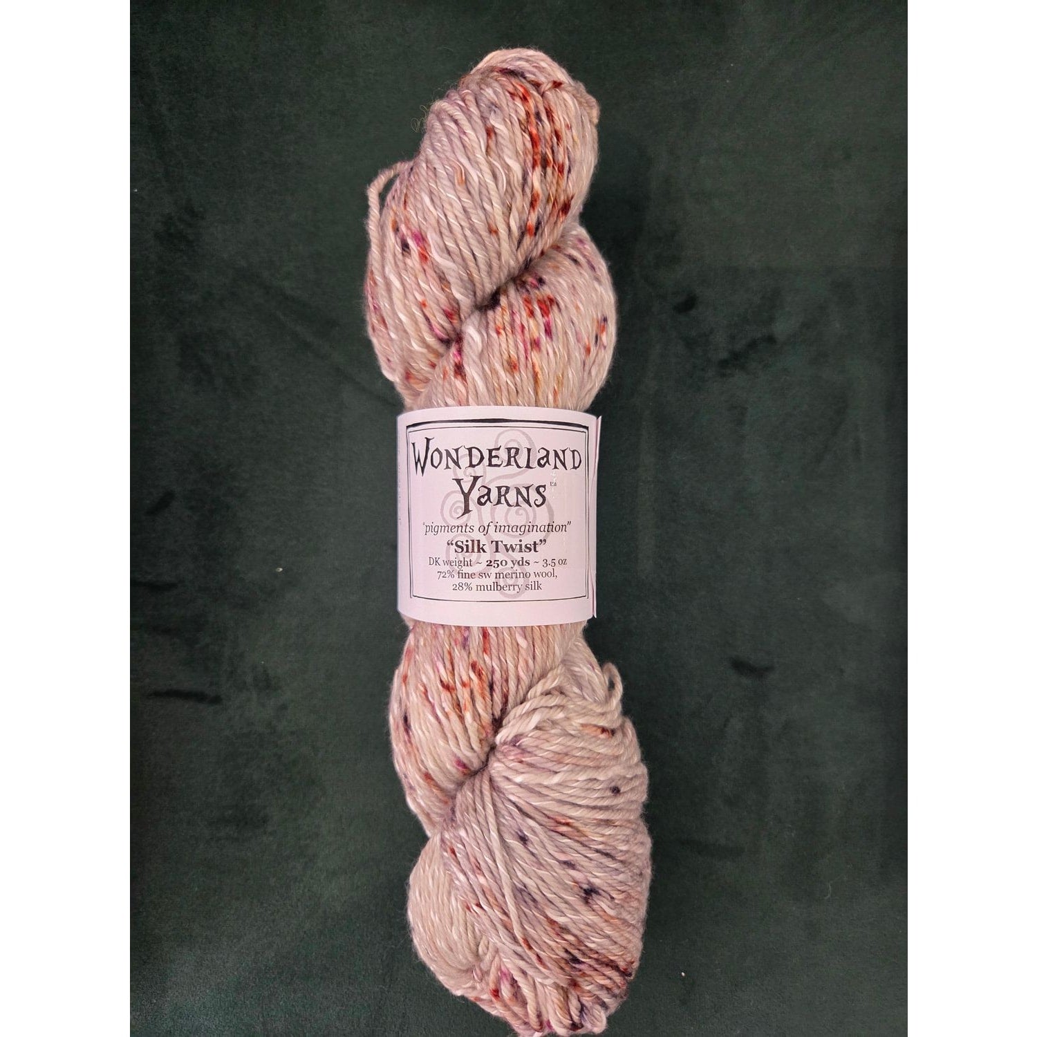 Frabjous Fibers skein of Wonderland Yarns Silk Twist hand dyed speckled cream pink silk blend yarn