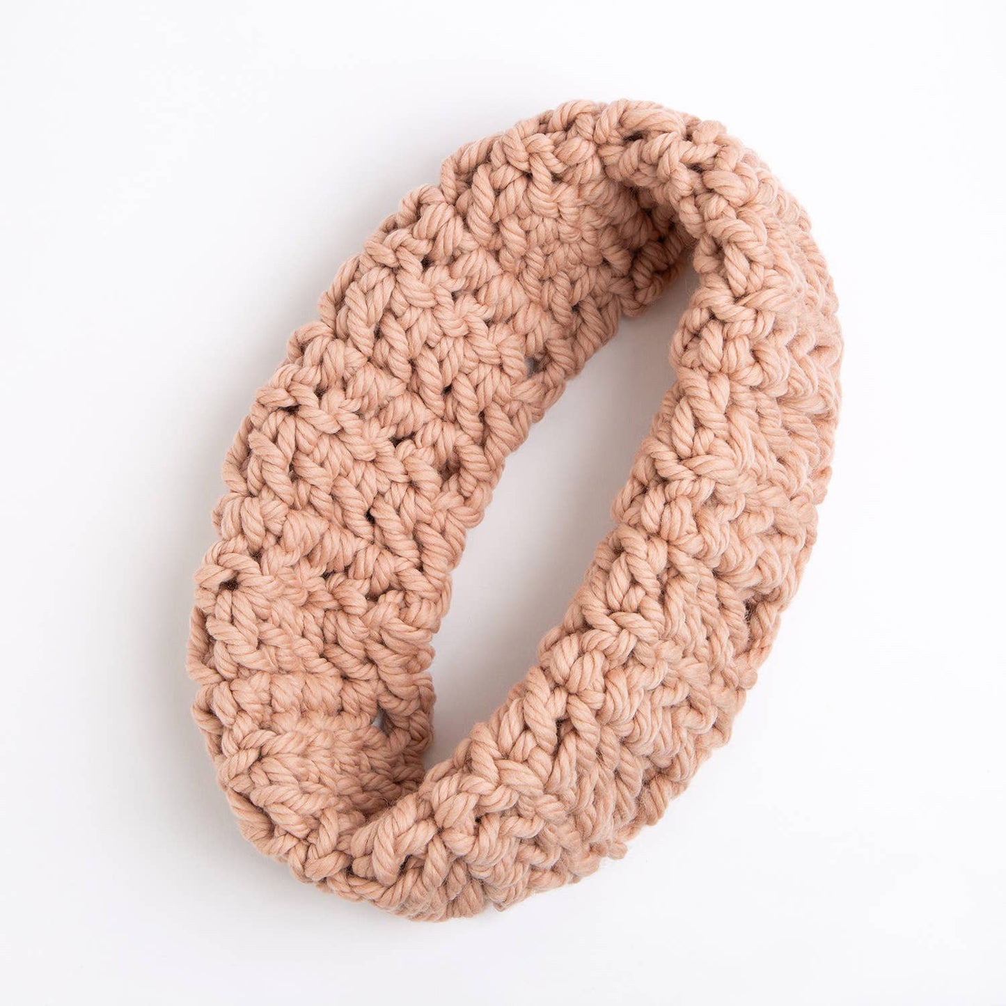 Wool Couture Company beginner crochet cowl kit showing chunky beige infinity cowl with large stitches