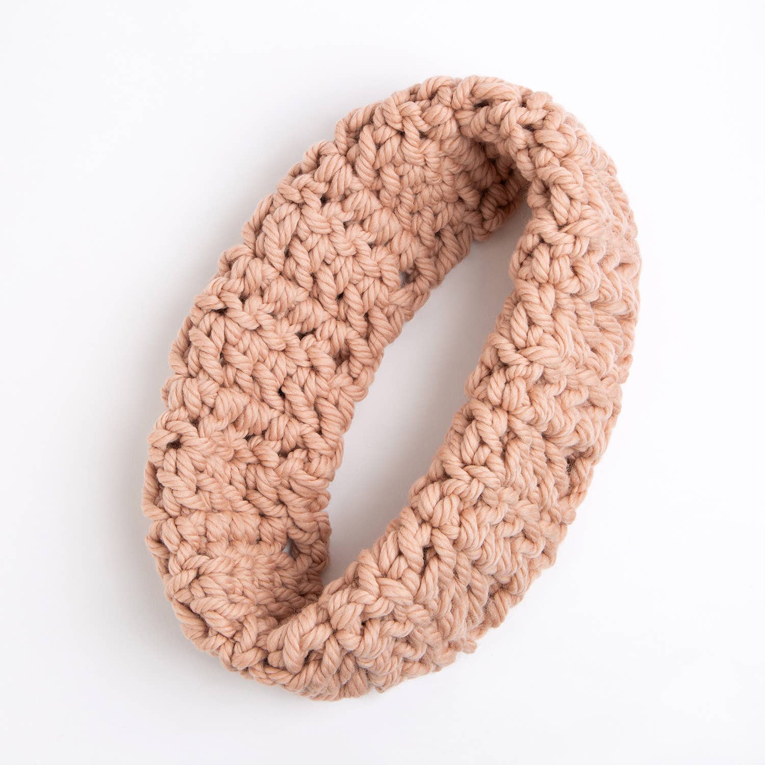Wool Couture Company beginner crochet cowl kit showing chunky beige infinity cowl with large stitches