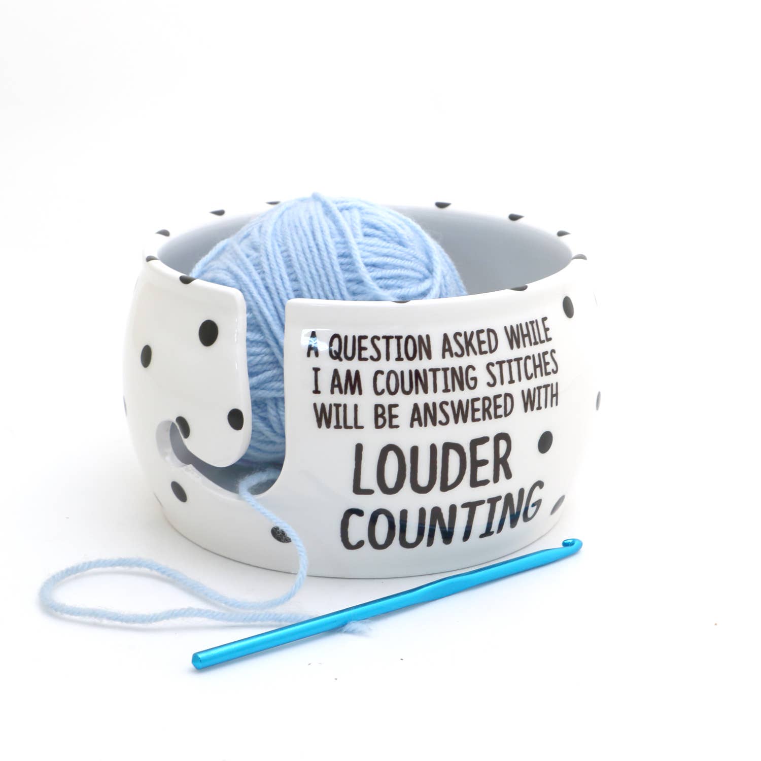 White ceramic yarn bowl for knitters with a fun counting quote and a light blue yarn ball