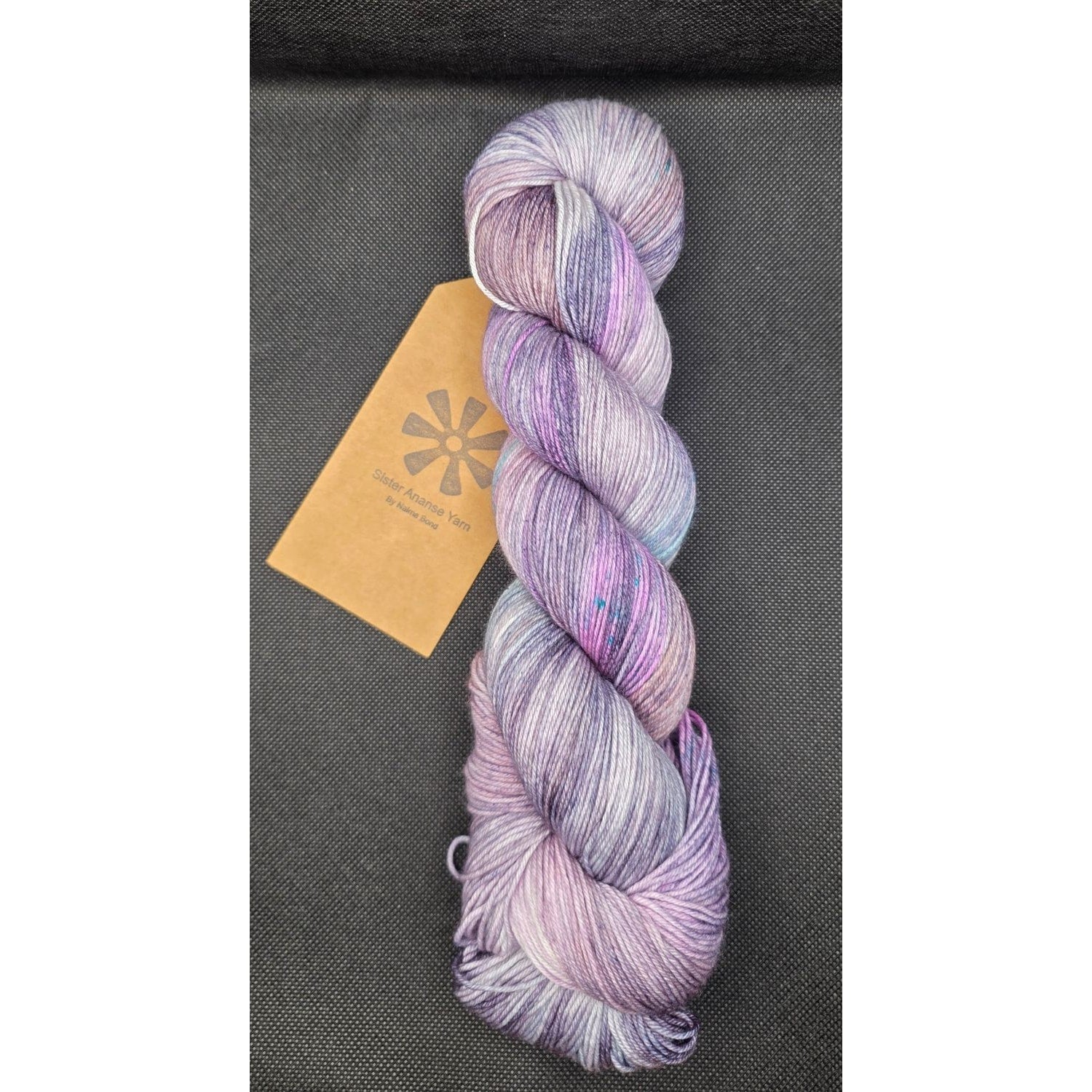 Sister Ananse iridescent yarn in purple tones, ideal for projects from yarn retailers near me