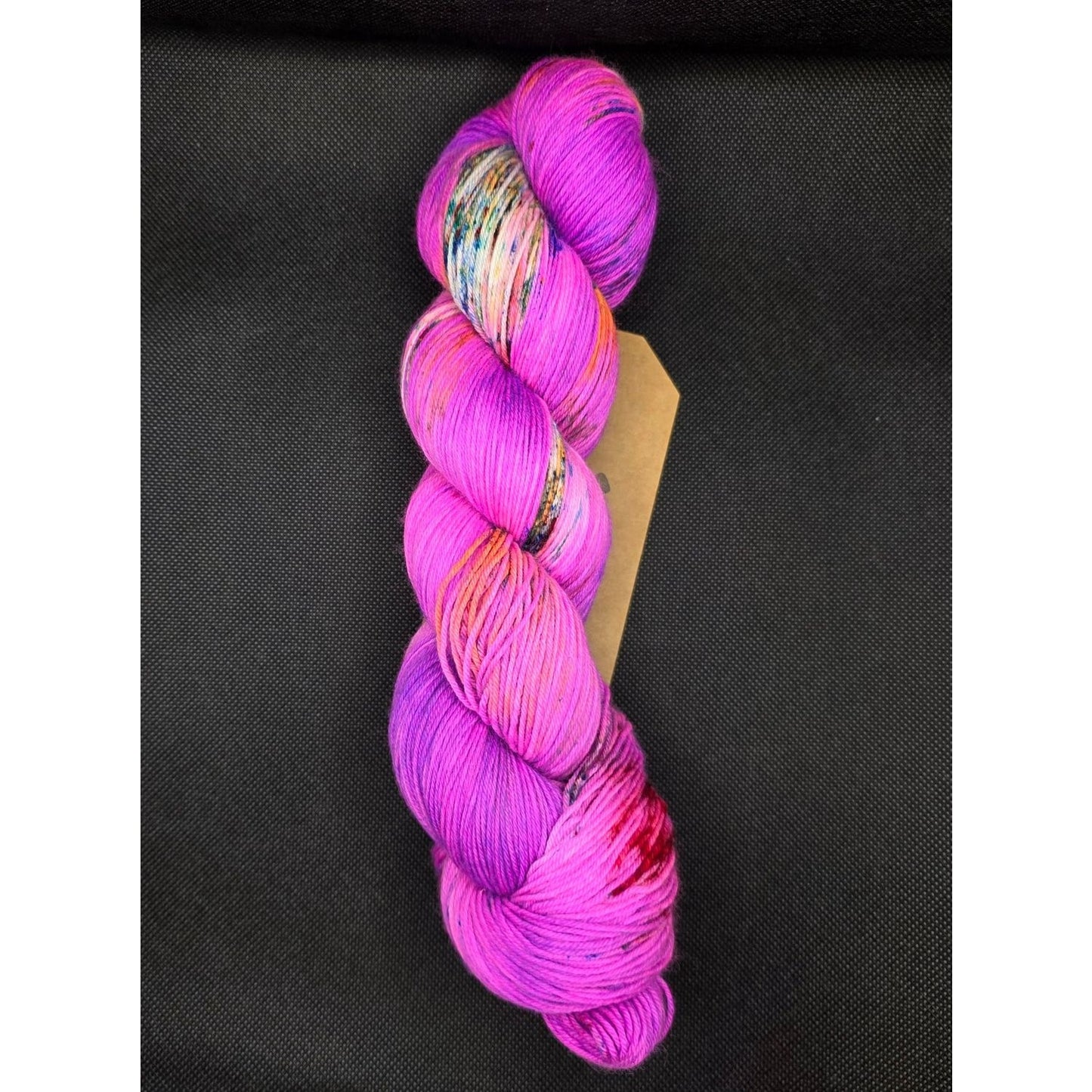 Hand-dyed vibrant pink Sistern Ananse yarn for creative knitting projects from yarn retailers near me