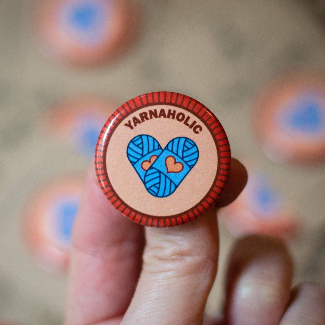 Yarnaholic pin featuring a heart design with yarn, perfect for yarn retailers near me enthusiasts