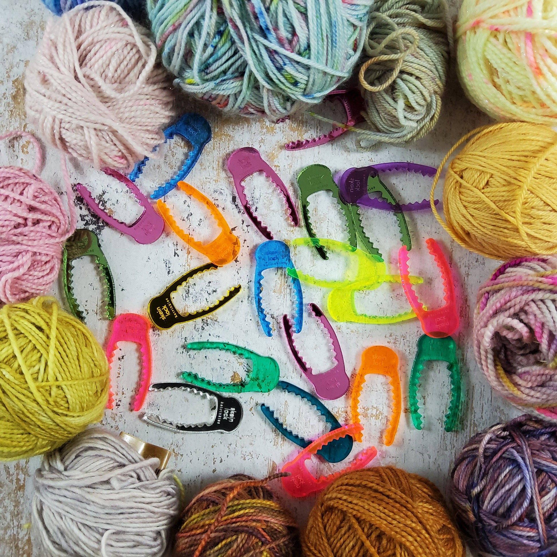 Colorful Katrinkles yarn spinning tool with various yarn skeins for knitting and crocheting projects