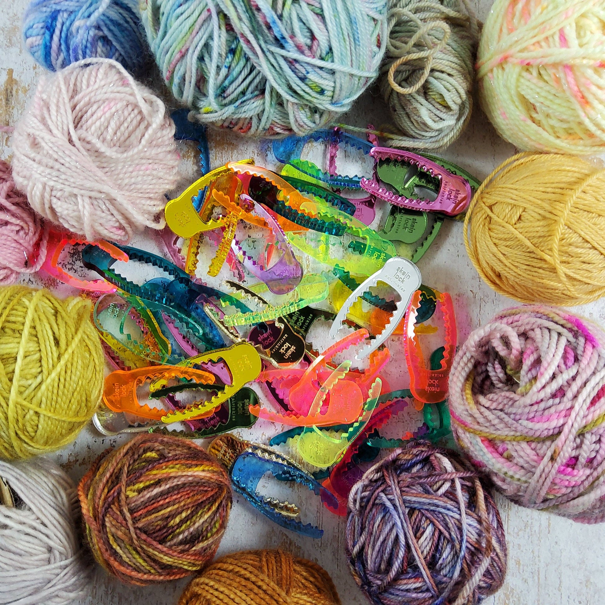Colorful yarns and Katrinkles yarn spinning tool with clips for organizing crafting projects